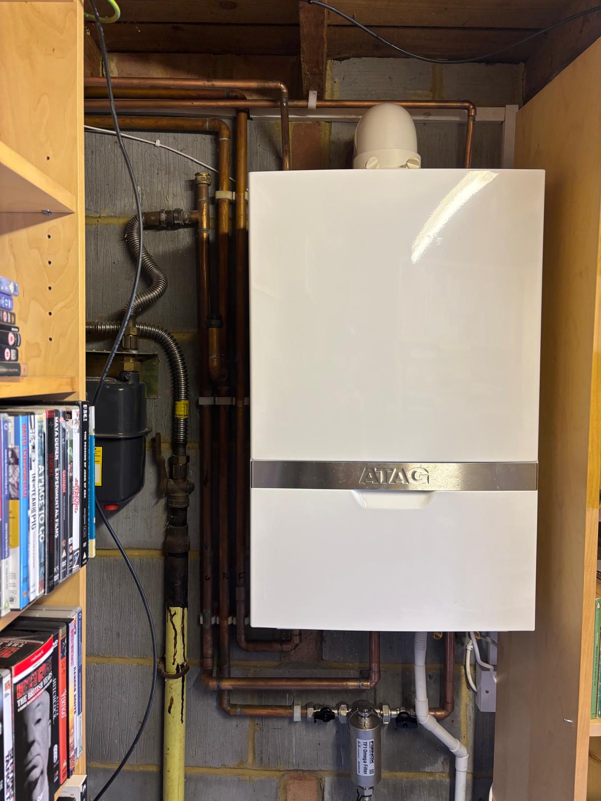 New boiler installed with neat copper pipework in a home utility space